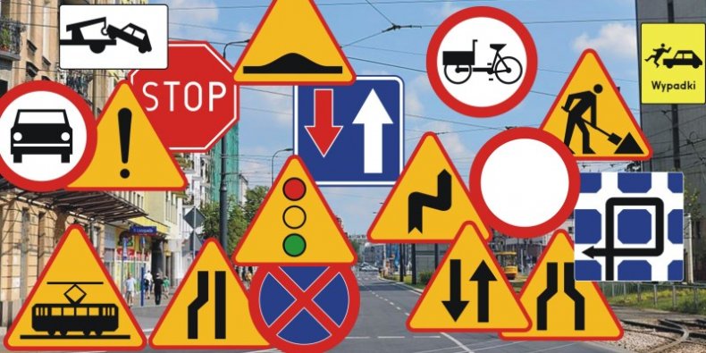Znaki drogowe na tle miasta